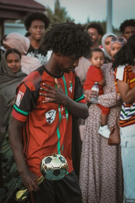 Fotbollsspelare och oddsdiagram illustrerar Value Betting-konceptet för att hitta värde i spelmarknaden.